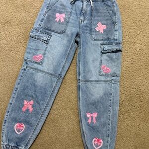 American Eagle Upcycled Denim Cargo Pants with Pink Bow Patches women’s size 4